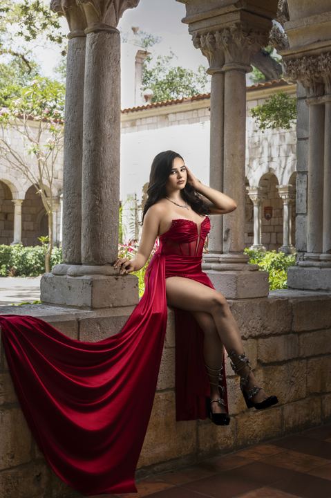 Quincea&ntilde;era photoshoot &mdash; red satin dress cloister column at The Ancient Spanish Monastery, Miami Visions Photography