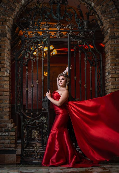 Quincea&ntilde;era photoshoot &mdash; red satin dress iron gate at The Cruz Building, Miami Visions Photography