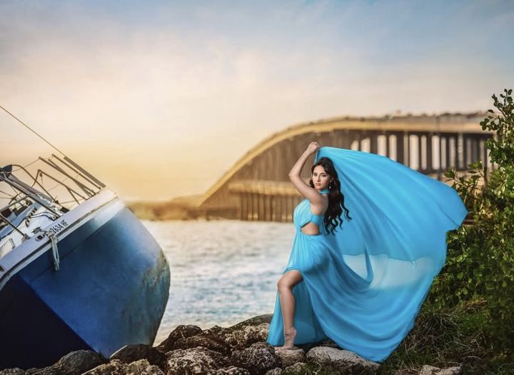 Quincea&ntilde;era photoshoot &mdash; blue flying dress bridge rocks at Key Biscayne, Miami Visions Photography