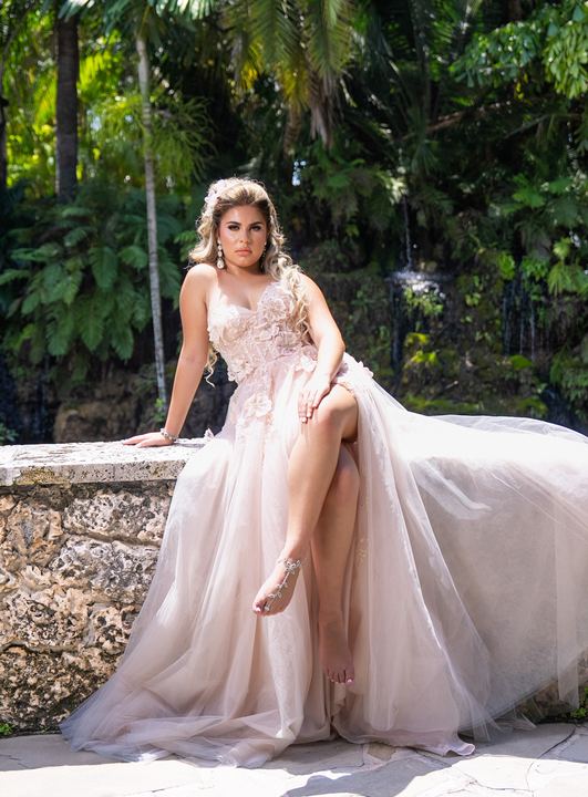 Quincea&ntilde;era photoshoot &mdash; blush lace gown coral wall at Secret Gardens Miami, Miami Visions Photography