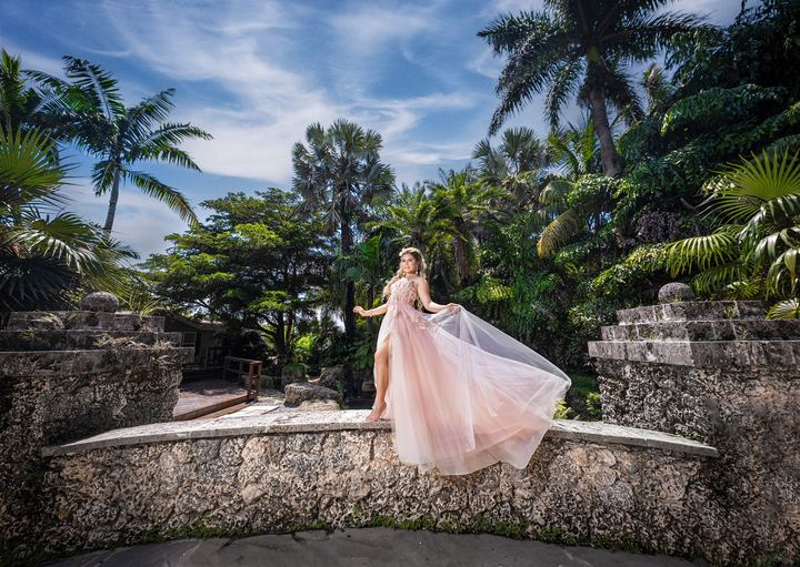 Quincea&ntilde;era photoshoot &mdash; blush gown stone bridge at Secret Gardens Miami, Miami Visions Photography