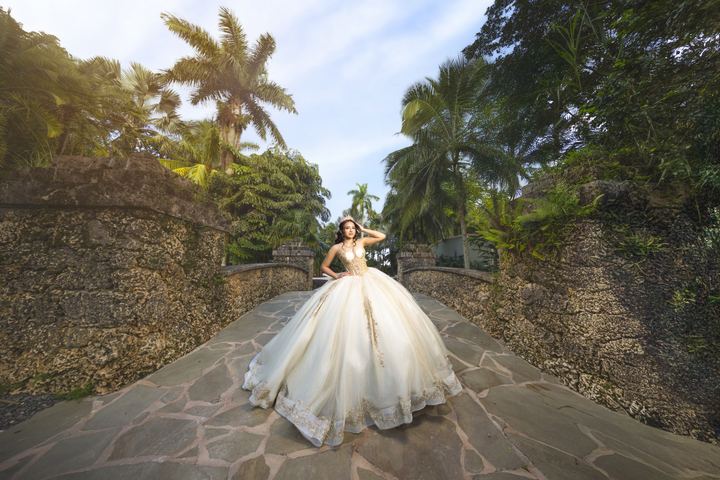 Quincea&ntilde;era photoshoot &mdash; ivory gold gown stone bridge palms at Secret Gardens Miami, Miami Visions Photography