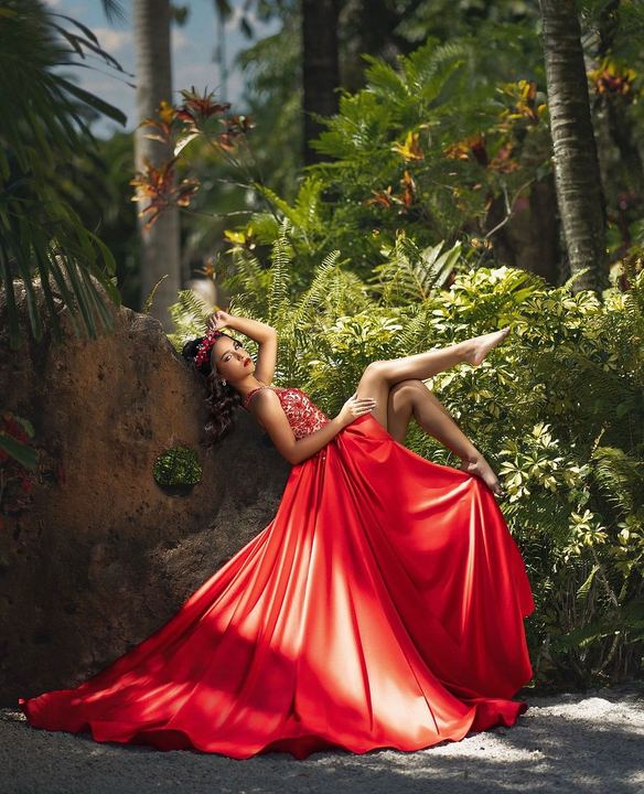 Quincea&ntilde;era photoshoot &mdash; red dress jungle recline at Secret Gardens Miami, Miami Visions Photography