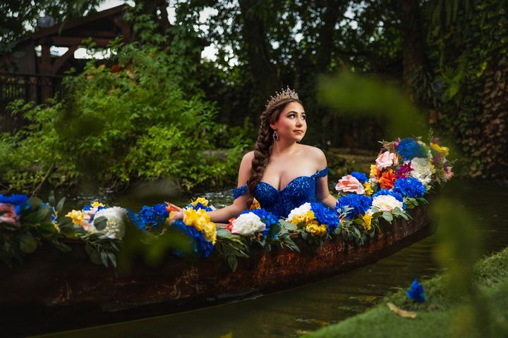 Quincea&ntilde;era photoshoot &mdash; blue gown flower canoe at Villa Toscana Miami, Miami Visions Photography