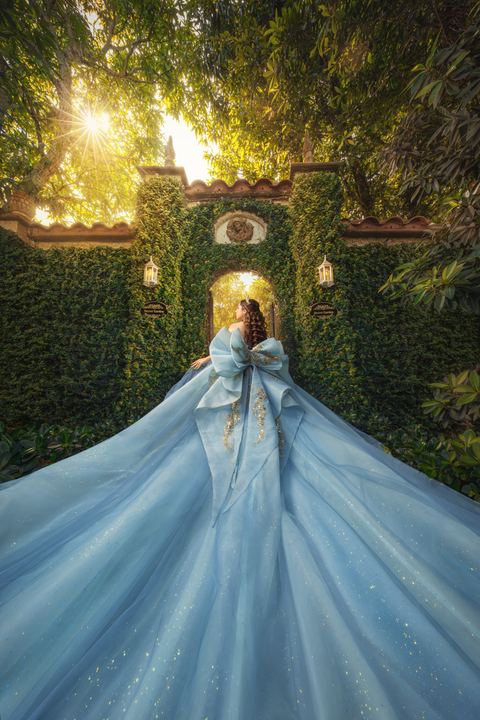 Quincea&ntilde;era photoshoot &mdash; blue bow gown ivy courtyard gate at Villa Toscana Miami, Miami Visions Photography