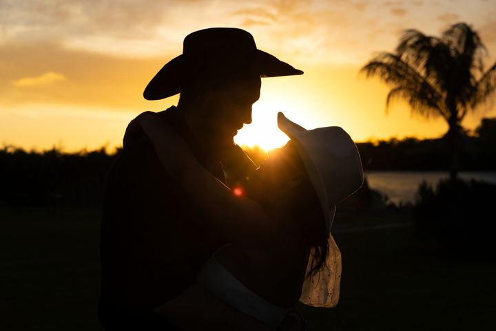 Cowboy hat silhouette golden sunset &mdash; wedding photography by Miami Visions, Miami