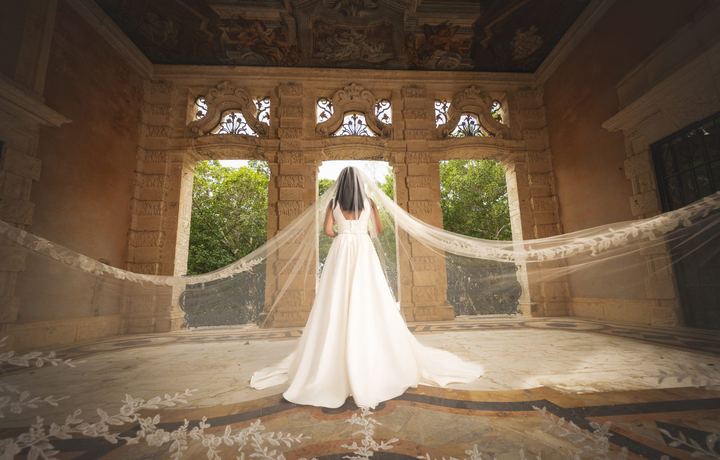 Bride with cathedral veil in Vizcaya loggia, Miami wedding photography