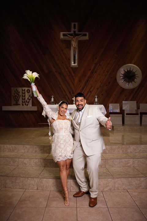 Newlyweds celebrating chapel altar &mdash; wedding photography by Miami Visions, Miami