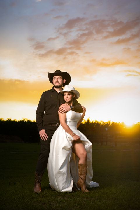 Bride groom cowboy hats ranch sunset &mdash; wedding photography by Miami Visions, Miami