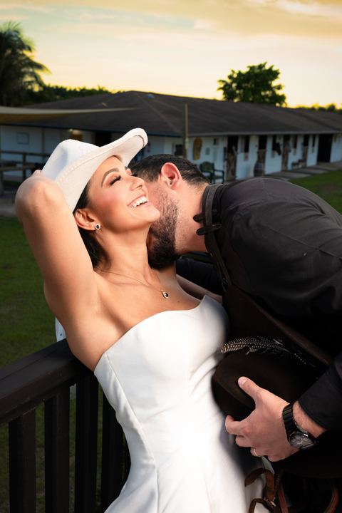 Groom kiss bride laughing ranch &mdash; wedding photography by Miami Visions, Miami